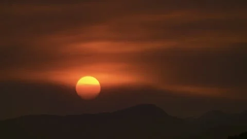 The Setting Sun Through the Forest Fire Smoke Stock Footage 315694675