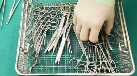 Setting surgical instruments and tools on a table for a surgery Stock Footage 42621560