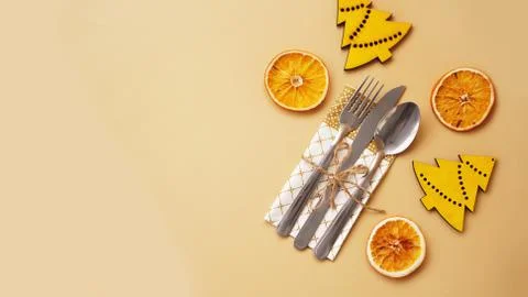 Setting of table with dry orange and wooden christmas figurines Stock Photos