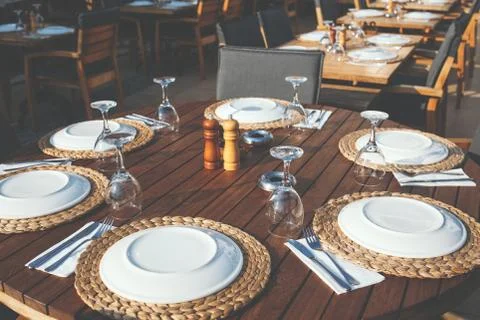Setting table in restaurant. Stock Photos