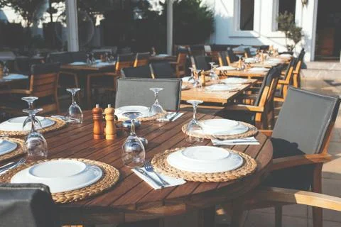 Setting table in restaurant. Stock Photos