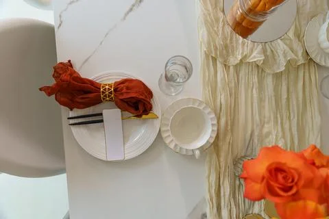 Setting a table for a special meal with decorations and place settings in a.. Stock Photos