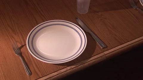 Setting Table with Special Needs Spoon Stock Footage 50766270