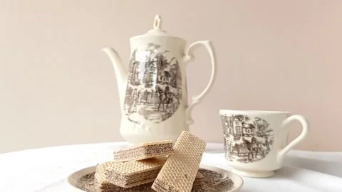 Setting up the table for a tea party with friends Stock Footage 145561742