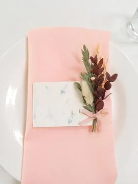 Setting the table for a wedding. Flowers, white tablecloth, dishes. Decor Stock Photos
