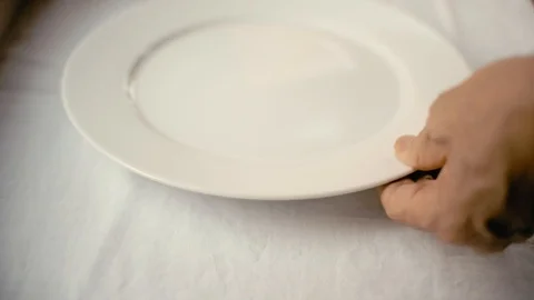 Setting the table on a white tablecloth Stock Footage 101214529