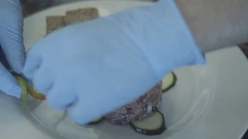 Setting up the tartare dish with vegetables Stock Footage 86076185