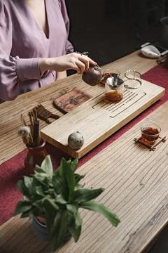 Setting up a Tea Ceremony that involves using Natural Elements and Various Stock Photos
