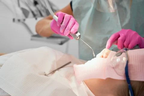 Setting teeth with UV light. Stock Photos
