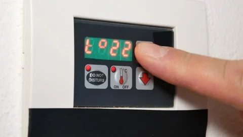 Setting the temperature on the air conditioner Stock Footage 90341786