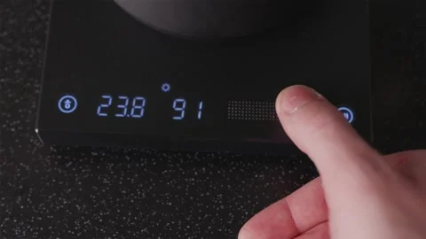Setting temperature on digital control panel of electric kettle Stock Footage 332720243