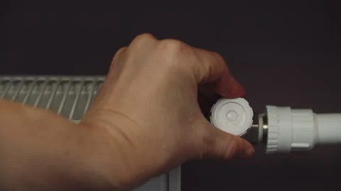 Setting the temperature of the heating radiator in the apartment Stock Footage 270515625