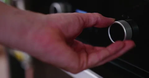 Setting temperature of an oven Stock Footage 248629689