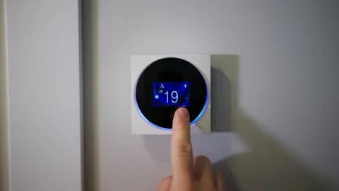 Setting the temperature in the room. Setting the house temperature via the Stock Footage 270404106
