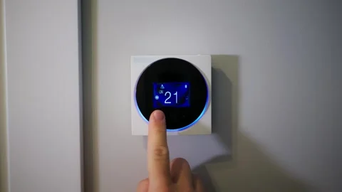 Setting the temperature in the room. Setting the house temperature via the Stock-Footage 270404123
