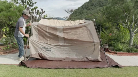 Setting Up a Tent in a Backyard Stock Footage 346534108