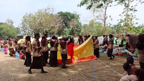 Setting up tents in the field when the wind was strong. Stock Footage 249657538