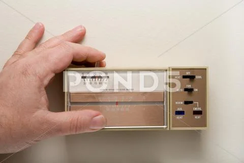Setting a Thermostat to Cool Stock Photos