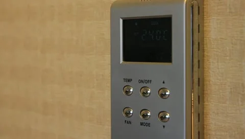 Setting thermostat temperature Stock Footage