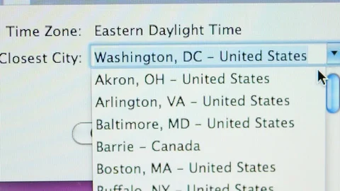 Setting the time zone on Apple iMac computer Video stock 103877967