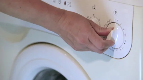 Setting the washing program for the washing machine Video stock 206286024