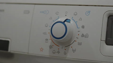 Setting washing programme with a dial 4K video Stock Footage 172114451