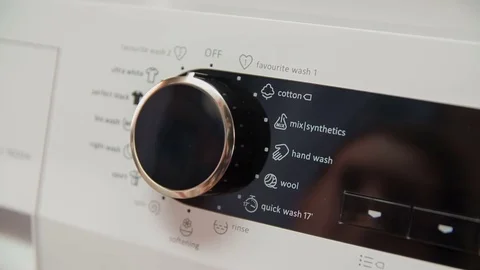 Setting washing programme to the right option and pressing the button start Stock Footage 82265711