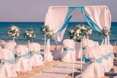 Setting up a wedding on the beach. Stock Photos