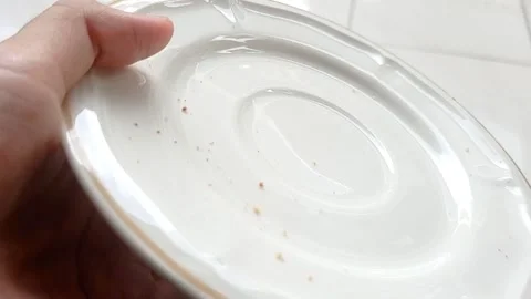 Setting a white plate on a brown table Stock Footage 146251985