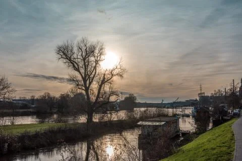 The setting winter sun over the Main River near Frankfurt Hoechst Germany Stock Photos
