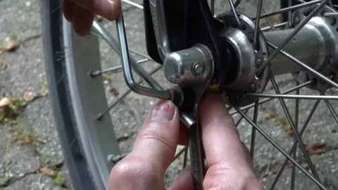 Setting Up a Wrench and Allen Key on Bike Wheel-1 Stock Footage 276423830