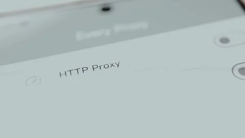 Settings menu for configuring a HTTP Proxy on a device, user switches the toggle Stock Footage 329748343