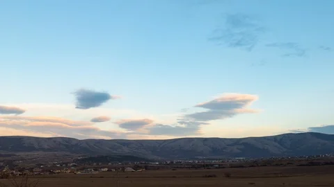 Settlement by the mountain at dusk, time lapse Stock Footage 121815995