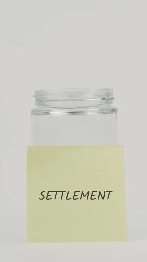 Settlement text or word on yellow sticky note attached to glass jar Stock Footage 311785564