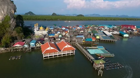 A settlement on water bordering a small island Video stock 111670487