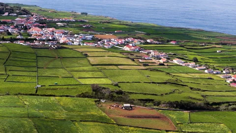 Settlements Through Agricultural Landscape With Green Patchwork Fields On Stock-Footage 335295030
