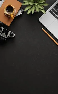 Setup of black desk with coffee cup on books, plant, laptop camera and a pe.. Stock Illustration