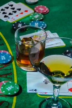 Setup for playing Blackjack at the Casino. WHisky and Martini glasses on the Stock Photos