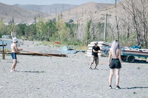 SEVAN, ARMENIA - Sep 03, 2021: A group of young people playing volleyball on  Stock Photos