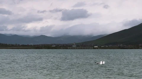 Sevan lake, Armenia. Idyllic scene with mountains and cloudy sky landscape Stock Footage 280183229