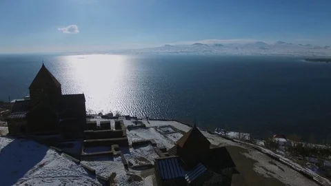 Sevan Monastery and Astvatsatsin Church on hill near Sevan Lake Stock Footage 76667514
