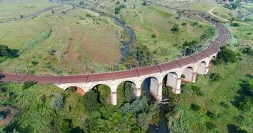 Seven arch rail bridge straddles Elands river near Waterval Boven South Afric Stock Footage 85954377