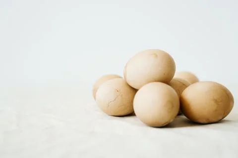 Seven Easter eggs trendy pastel colored with cracks lie on the table on a lig Foto stock