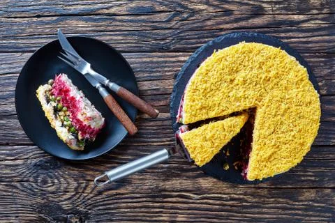 Seven layered salad on a black plate Stock Photos