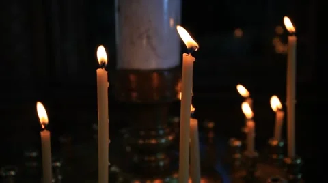 Seven red candles burning in the dark - black background Stock Footage 40051632