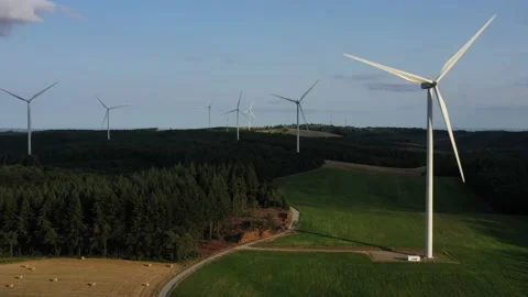 Seven wind turbines in the setting sun Stock Footage 144014812