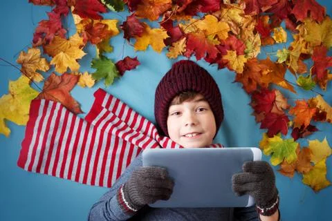 Seven years old boy dreaming in autumn Stock Photos