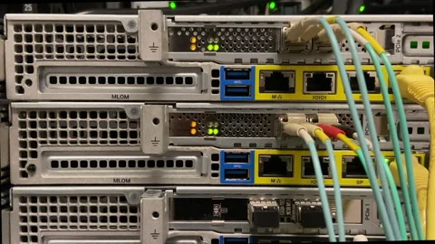 Sever equipment with blinking lights working in a data center Stock Footage 197791836
