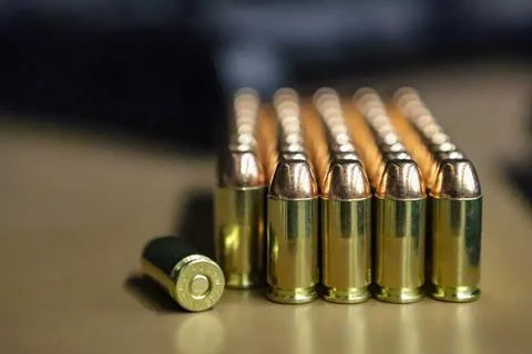 Several ammunition (projectiles) with the calibration 40 lined up Stock Photos
