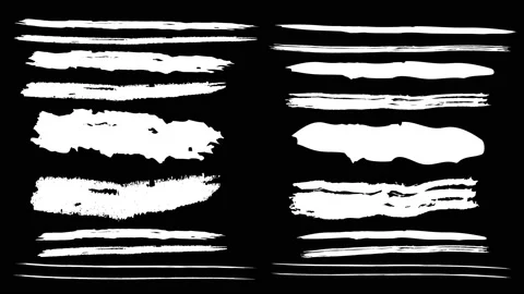 Several animated paint brushes on a black background. Stock Footage 114239752